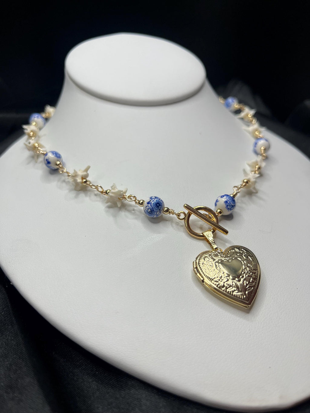 Rattlesnake Vertebrae Necklace with Blue Floral Ceramic Beads and Gold Plated Heart Locket | Toggle Closure – 16.5”