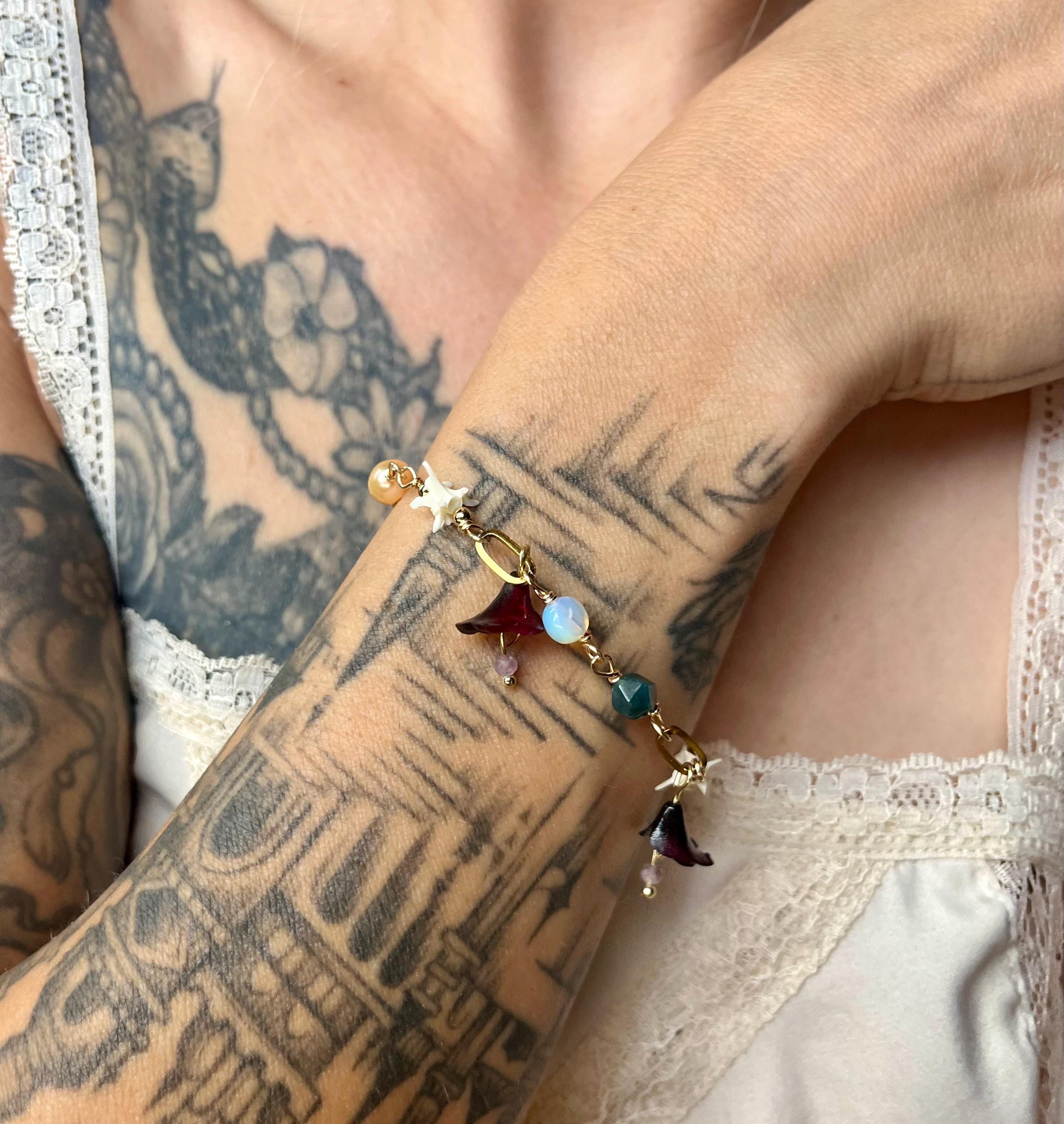 Garden of Eden Charm Bracelet – Pearl, Rattlesnake Vertebrae, Jade, Opalite & Acrylic Flowers