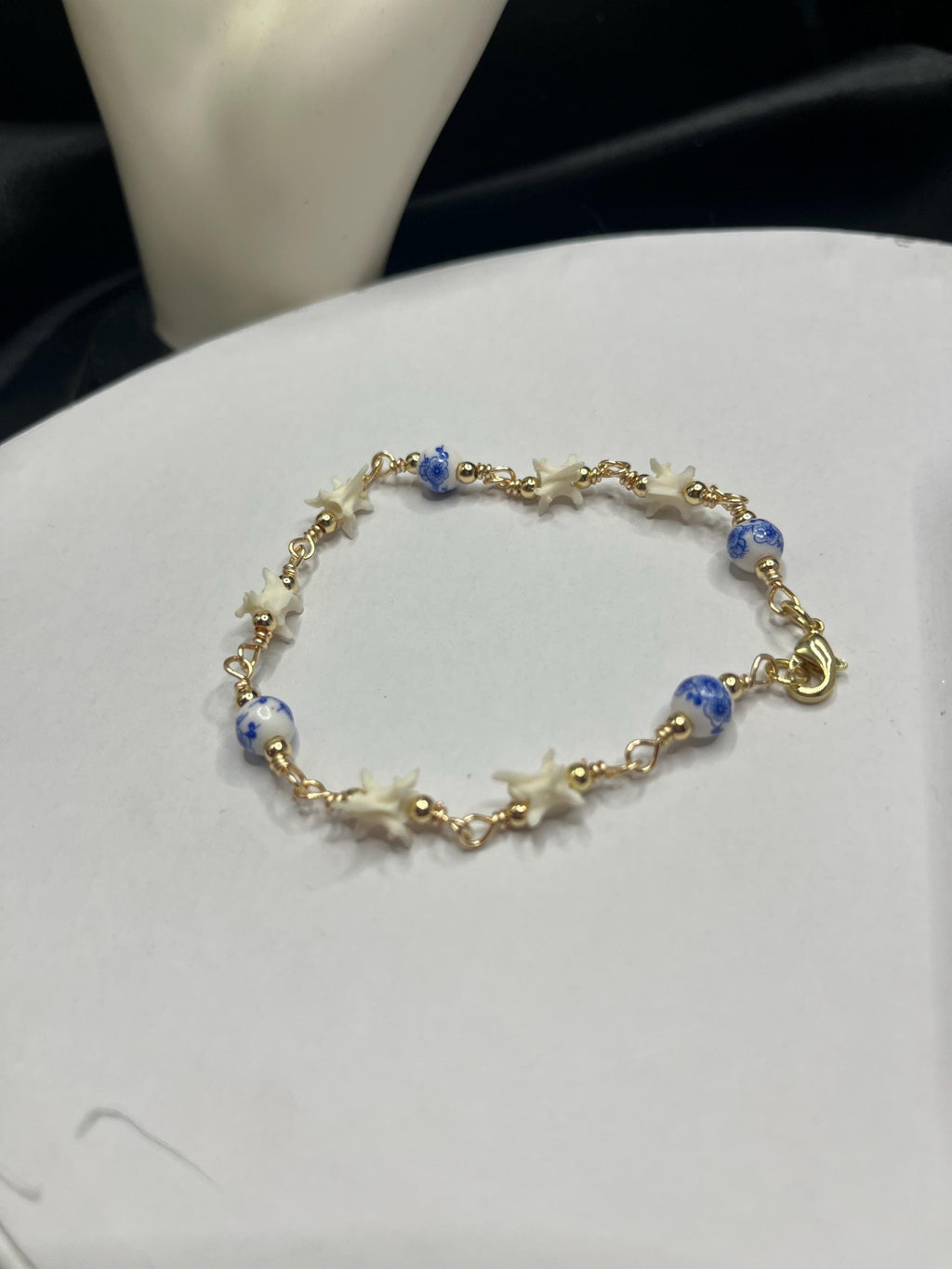 Blue Floral Ceramic Bead & Rattlesnake Vertebrae Bracelet