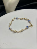 Blue Floral Ceramic Bead & Rattlesnake Vertebrae Bracelet