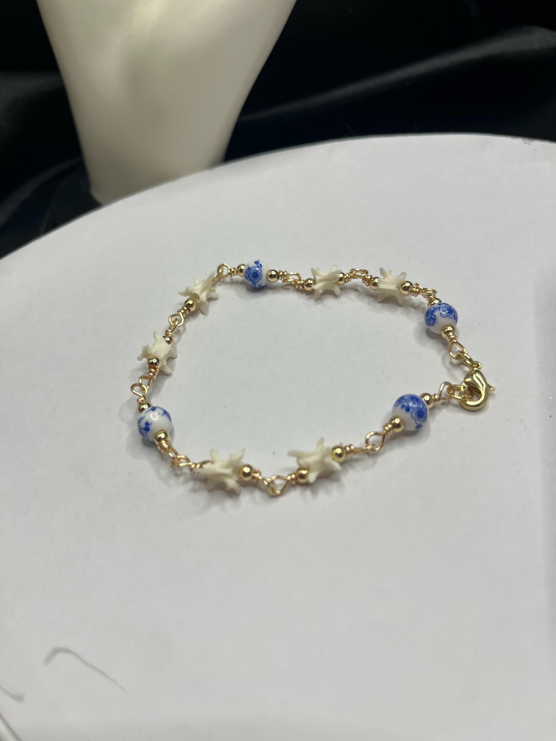 Blue Floral Ceramic Bead & Rattlesnake Vertebrae Bracelet