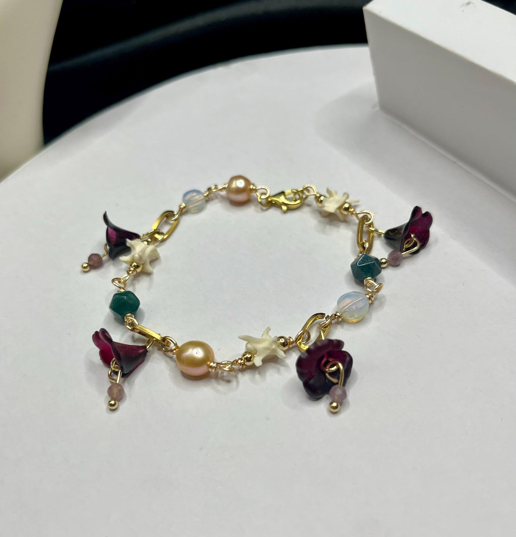 Garden of Eden Charm Bracelet – Pearl, Rattlesnake Vertebrae, Jade, Opalite & Acrylic Flowers