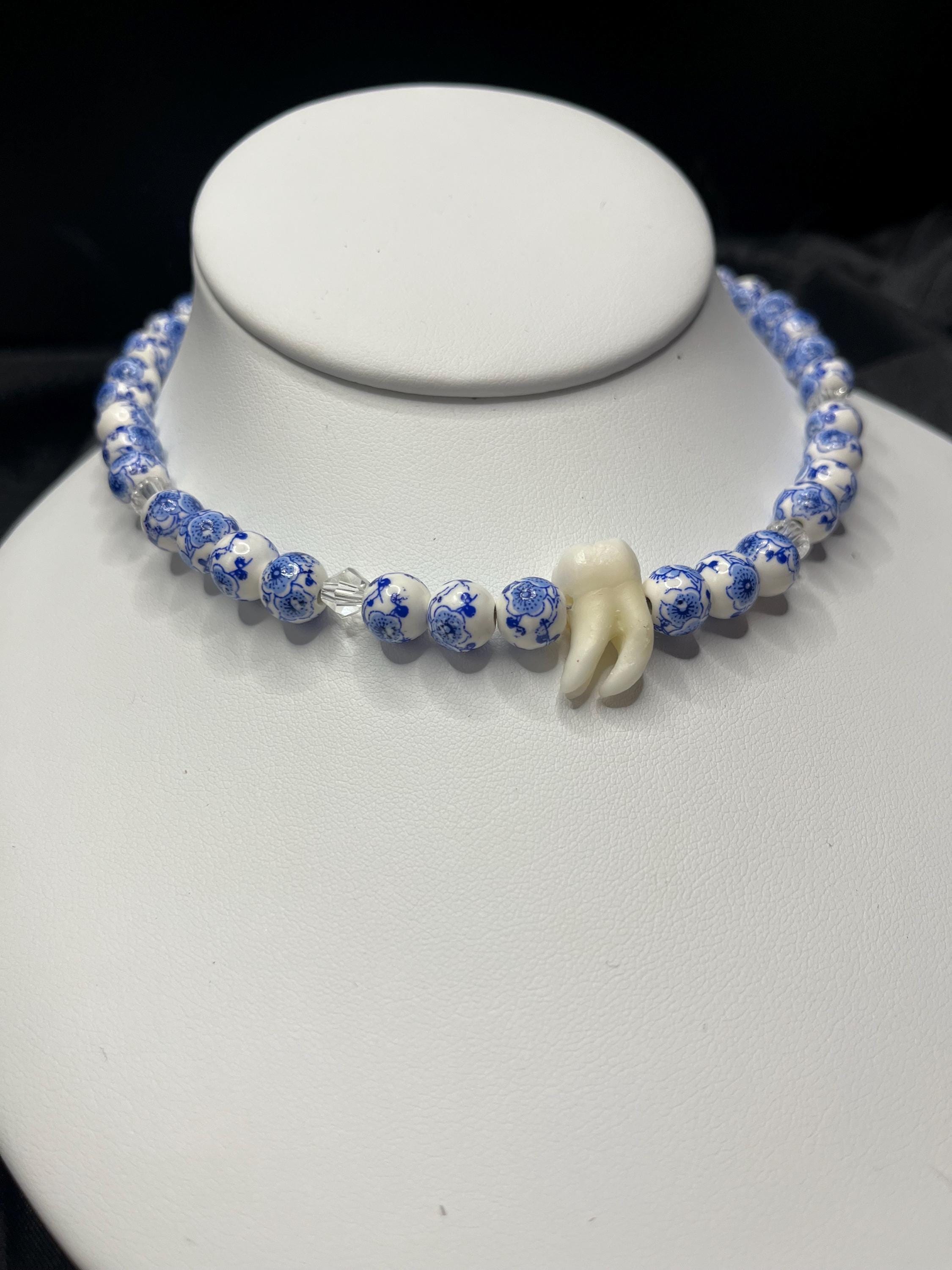 Human Tooth Necklace with Blue and White Floral Ceramic Beads and Crystal Accents, Stainless Steel, 14–16”