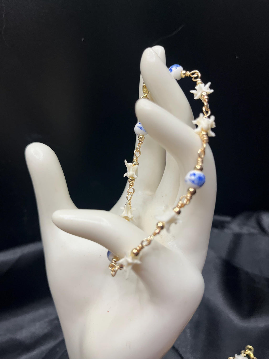 Blue Floral Ceramic Bead & Rattlesnake Vertebrae Bracelet