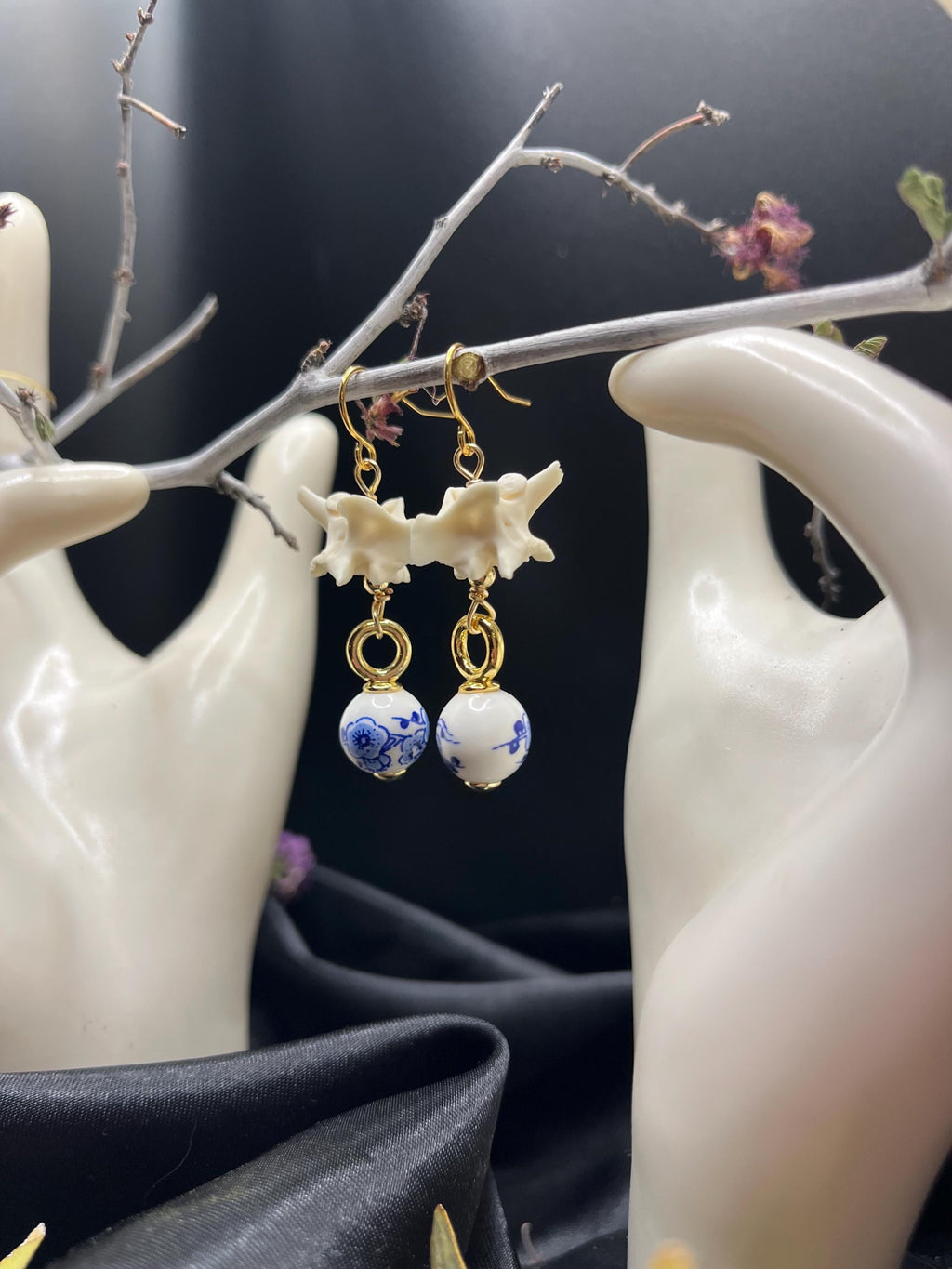 Rattlesnake Vertebrae and Blue Floral Ceramic earrings