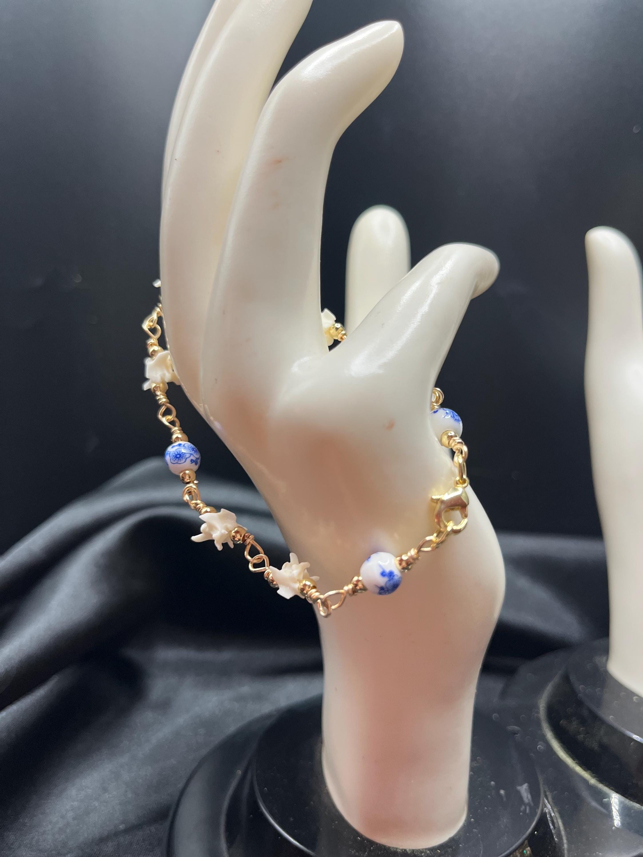 Blue Floral Ceramic Bead & Rattlesnake Vertebrae Bracelet