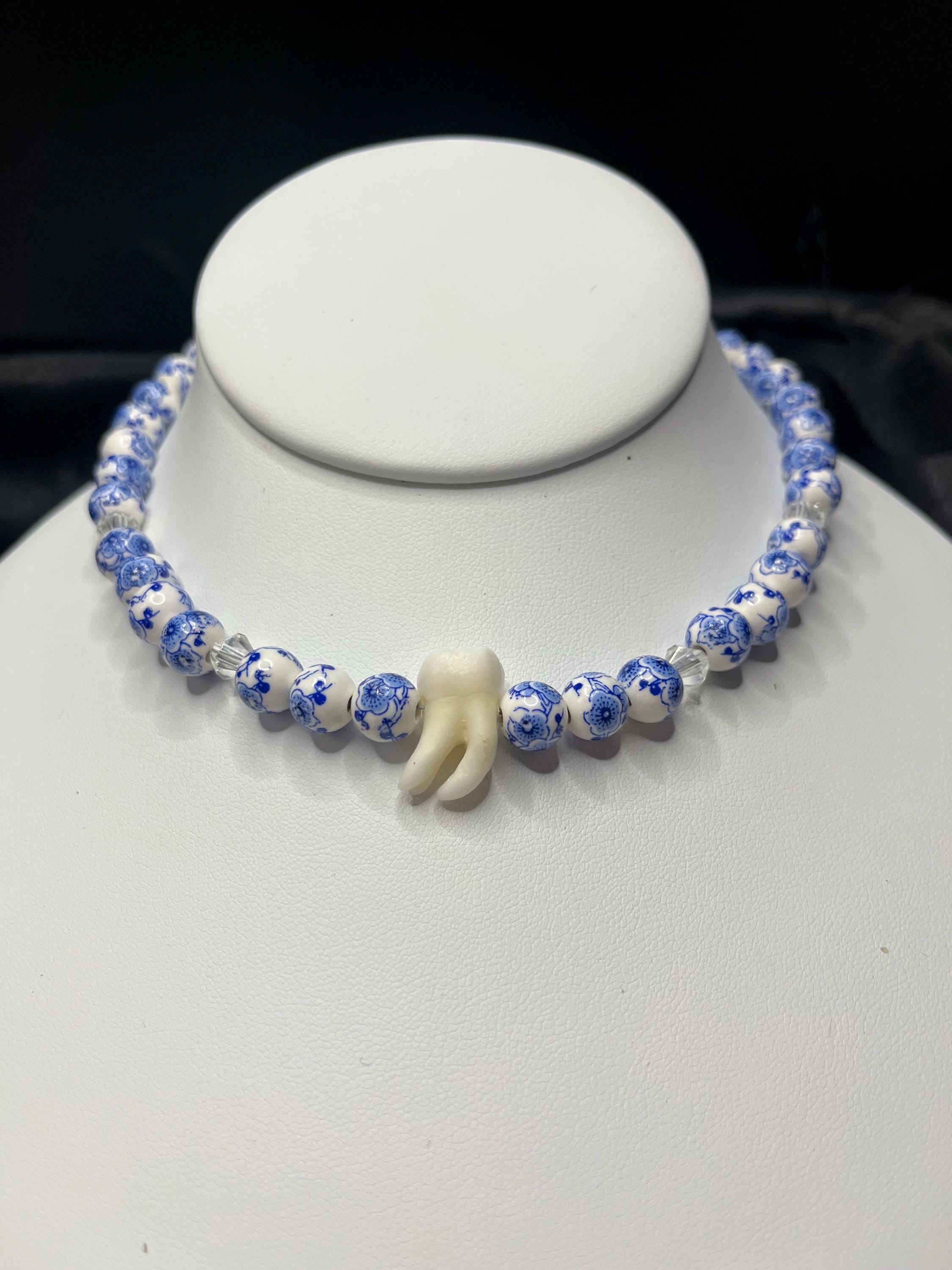 Human Tooth Necklace with Blue and White Floral Ceramic Beads and Crystal Accents, Stainless Steel, 14–16”