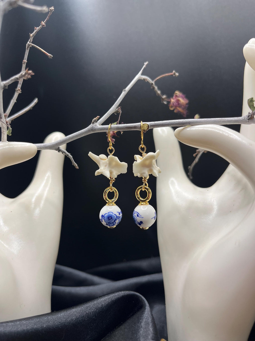 Rattlesnake Vertebrae and Blue Floral Ceramic earrings