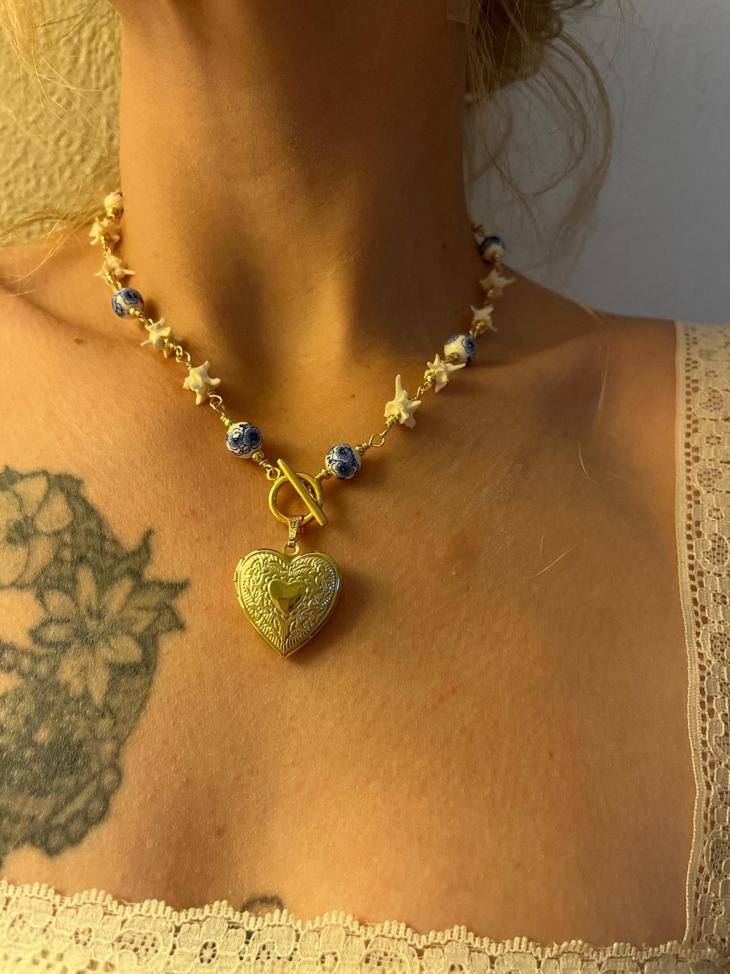 Rattlesnake Vertebrae Necklace with Blue Floral Ceramic Beads and Gold Plated Heart Locket | Toggle Closure – 16.5”