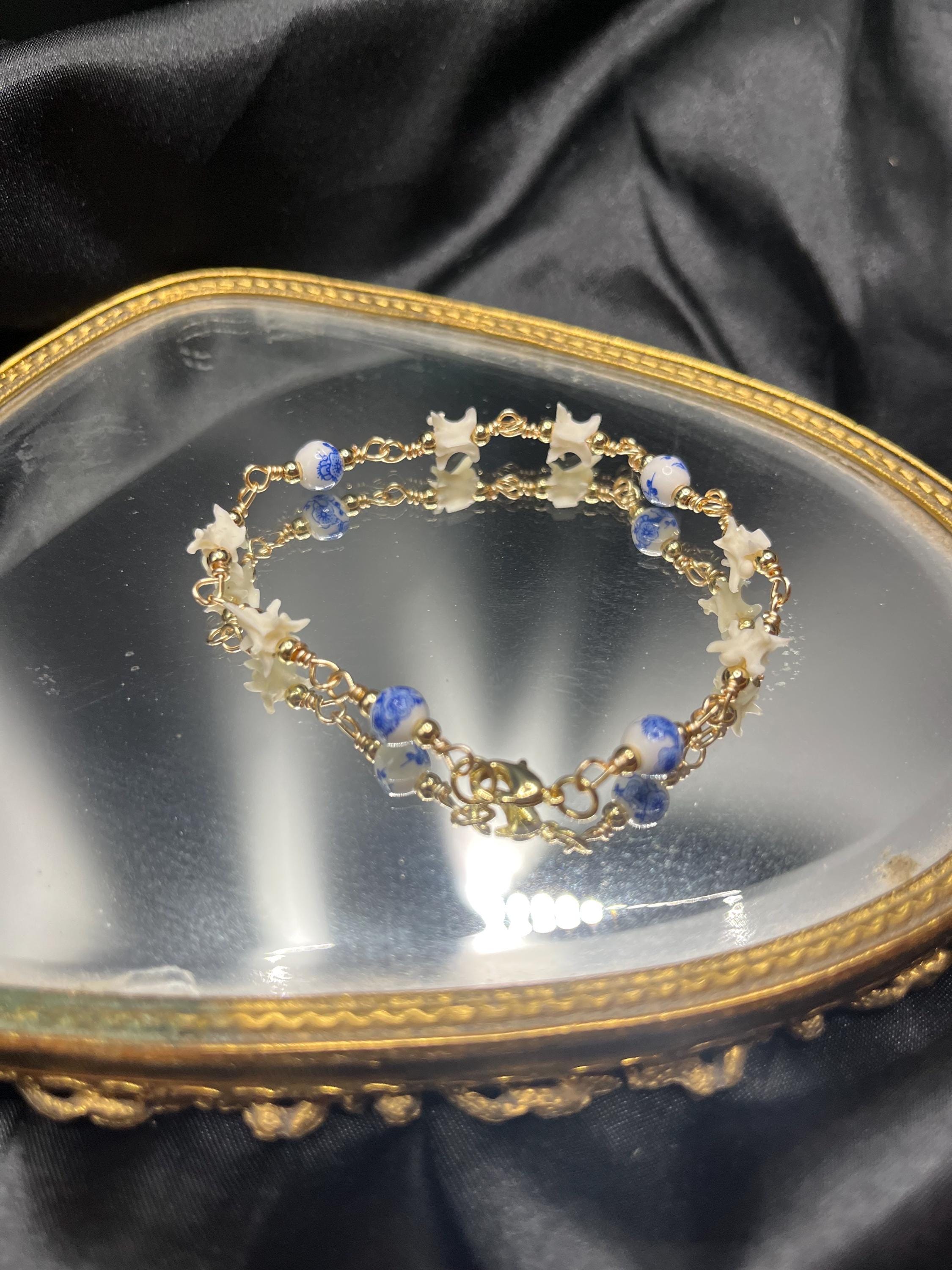 Blue Floral Ceramic Bead & Rattlesnake Vertebrae Bracelet