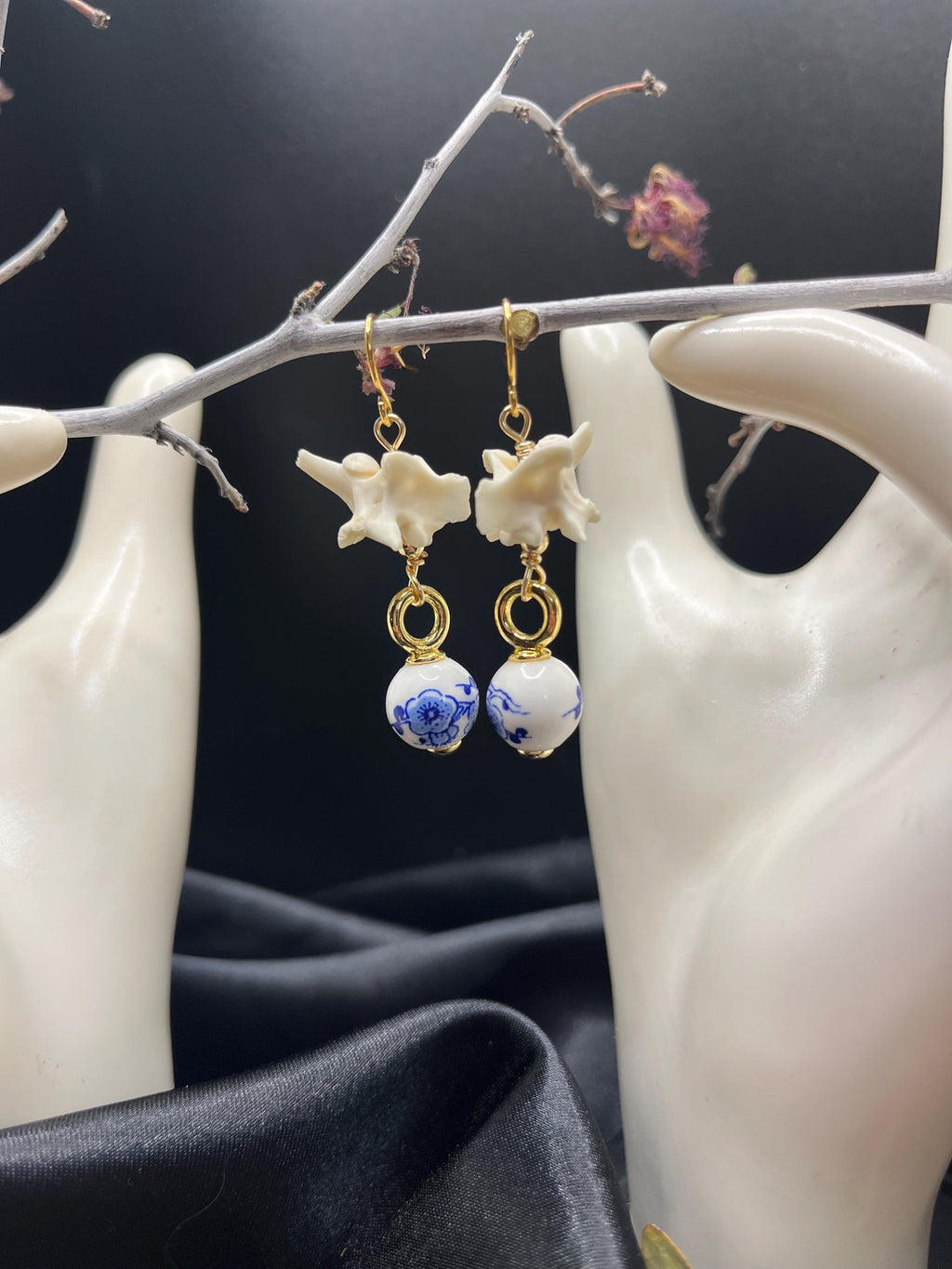 Rattlesnake Vertebrae and Blue Floral Ceramic earrings
