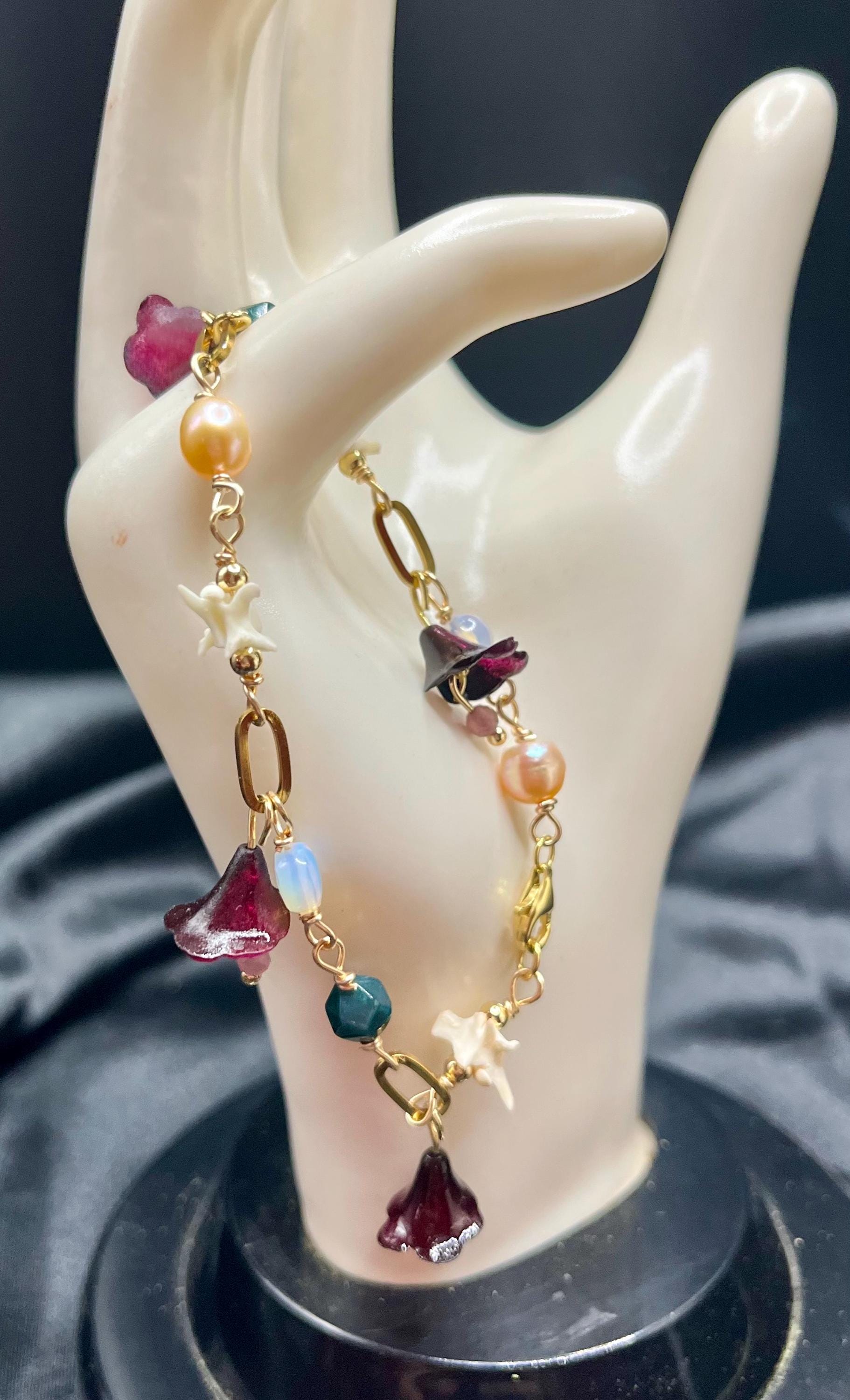 Garden of Eden Charm Bracelet – Pearl, Rattlesnake Vertebrae, Jade, Opalite & Acrylic Flowers