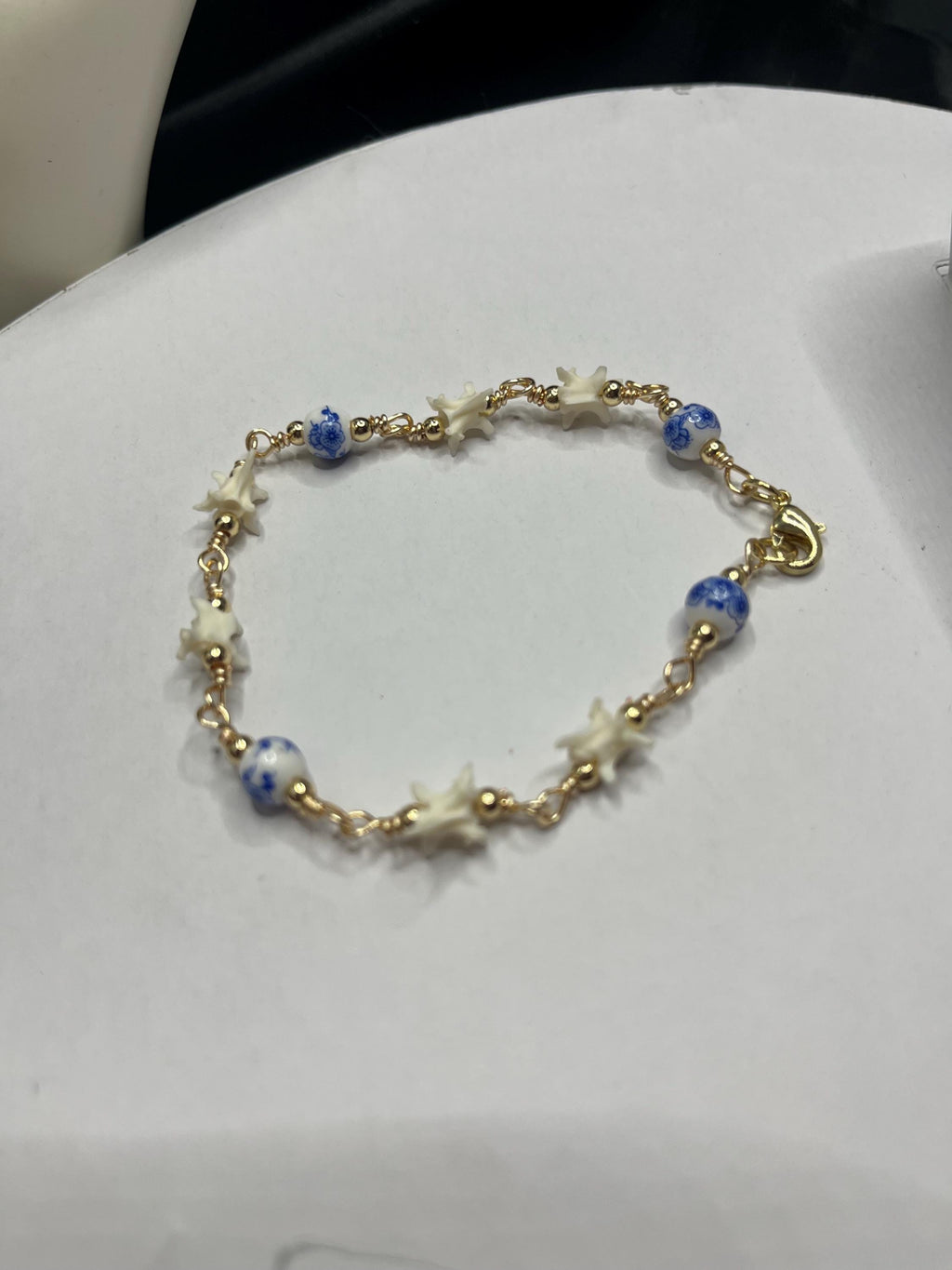 Blue Floral Ceramic Bead & Rattlesnake Vertebrae Bracelet