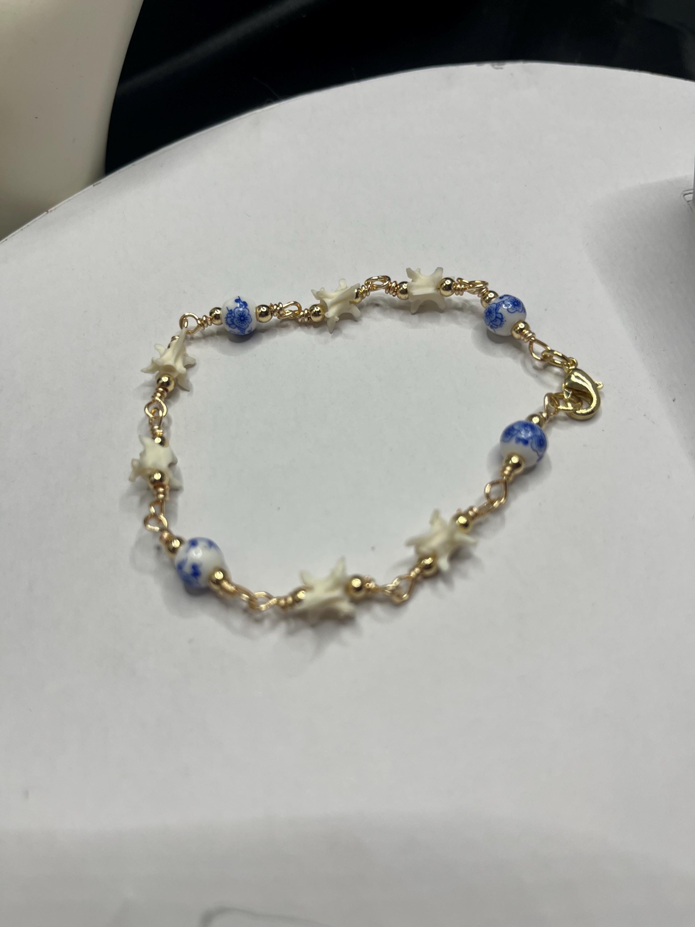 Blue Floral Ceramic Bead & Rattlesnake Vertebrae Bracelet
