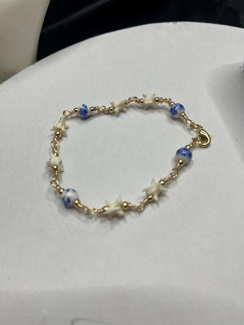 Blue Floral Ceramic Bead & Rattlesnake Vertebrae Bracelet
