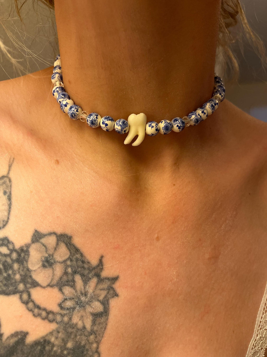 Human Tooth Necklace with Blue and White Floral Ceramic Beads and Crystal Accents, Stainless Steel, 14–16”