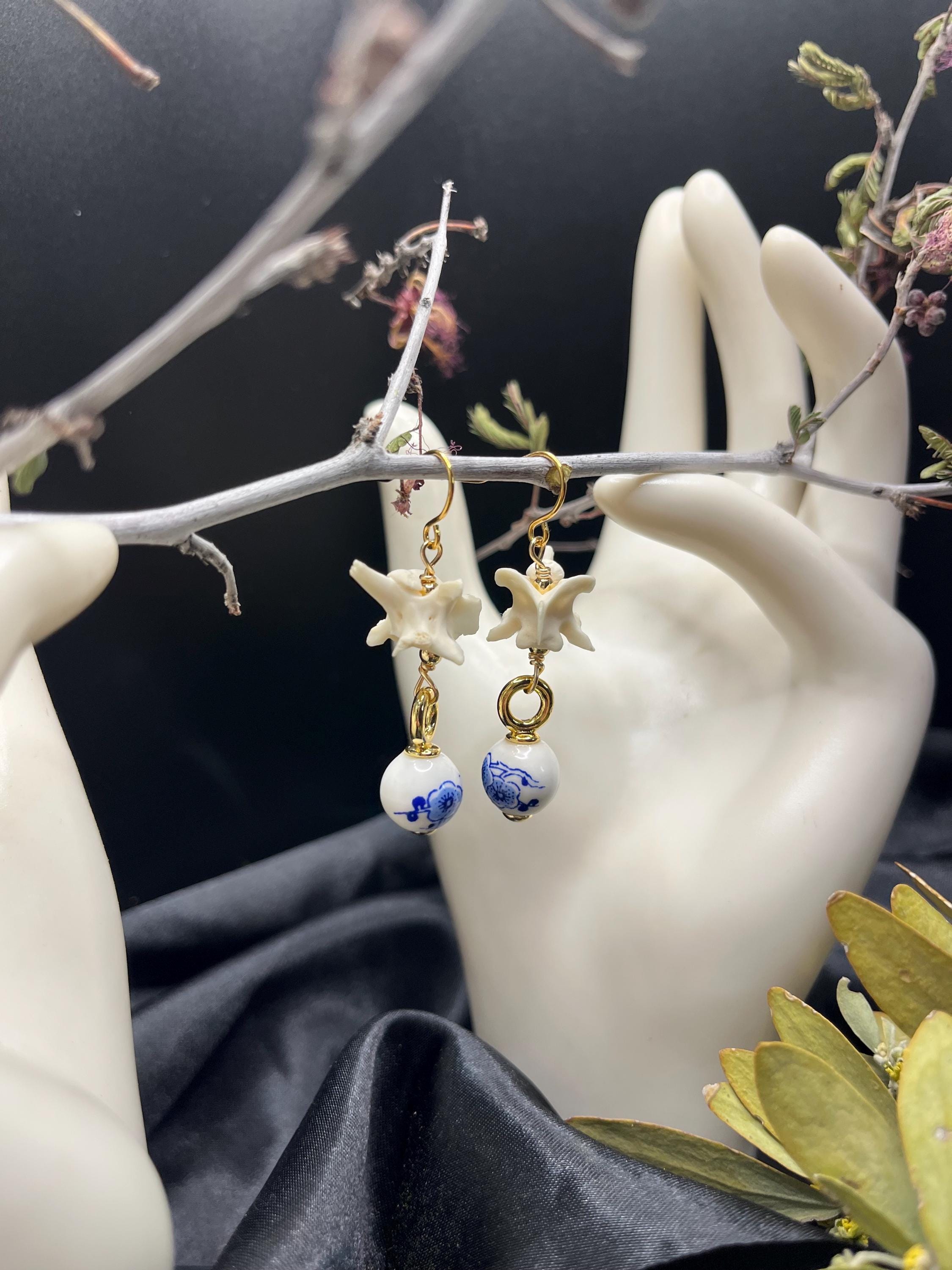 Rattlesnake Vertebrae and Blue Floral Ceramic earrings