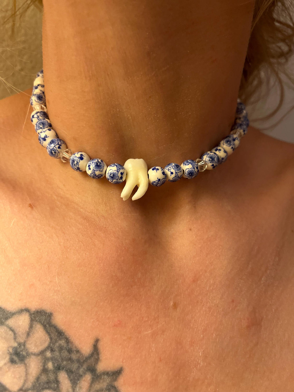 Human Tooth Necklace with Blue and White Floral Ceramic Beads and Crystal Accents, Stainless Steel, 14–16”