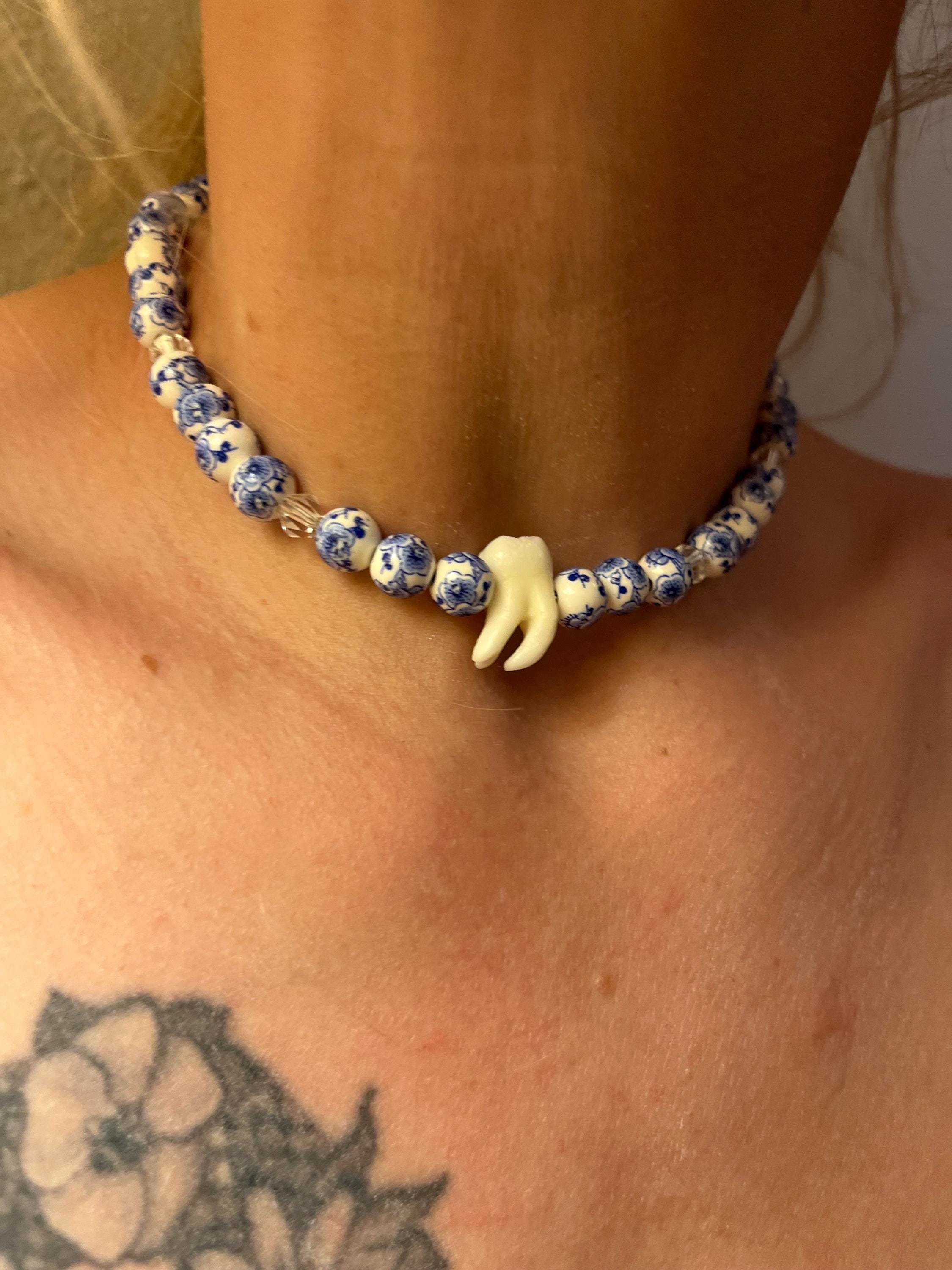 Human Tooth Necklace with Blue and White Floral Ceramic Beads and Crystal Accents, Stainless Steel, 14–16”