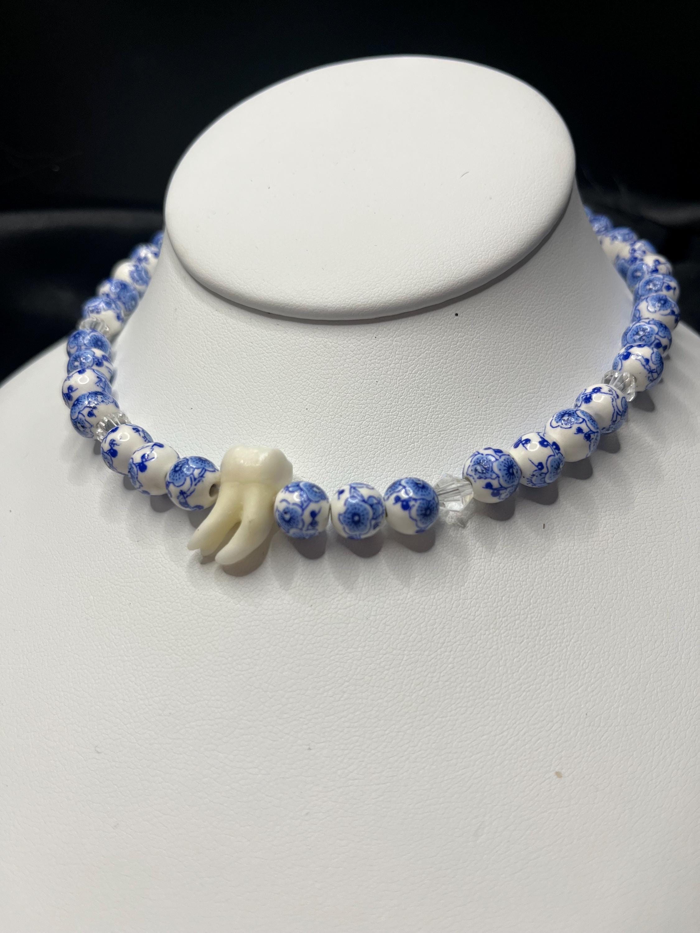Human Tooth Necklace with Blue and White Floral Ceramic Beads and Crystal Accents, Stainless Steel, 14–16”