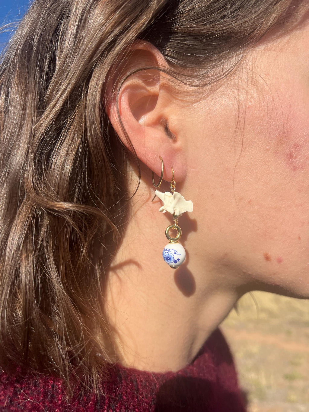 Rattlesnake Vertebrae and Blue Floral Ceramic earrings